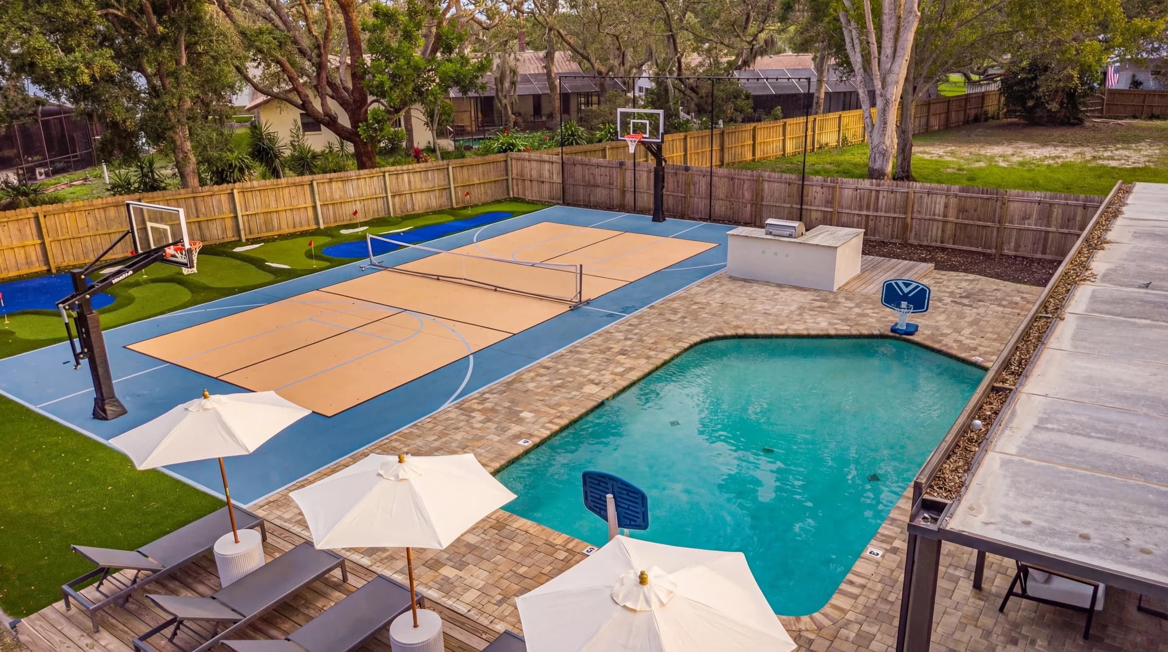 The Resort 057 1b7I9Lpt48VLFJZ6EI1Ky0HU5 Di92aq8 CLR1 YARD aerial pool and court AFTER